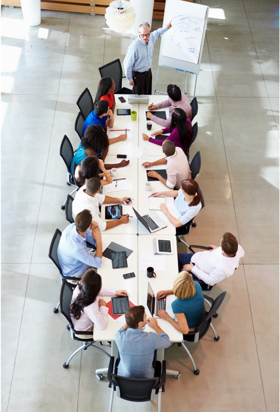 Business leaders in discussion around a conference table